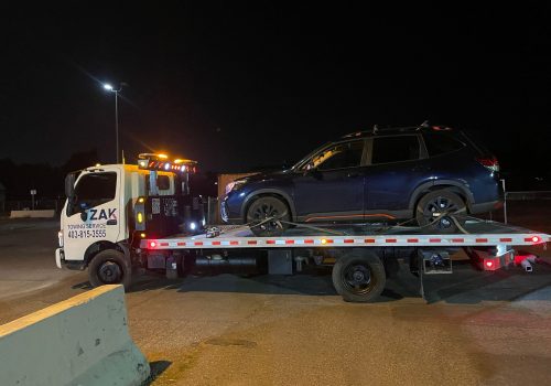 Zak Towing provides reliable 24/7 towing services in Calgary and surrounding areas for vehicles requiring safe and professional transportation. This image shows a blue SUV securely loaded onto our fla...Sorry but this string is too long !!!