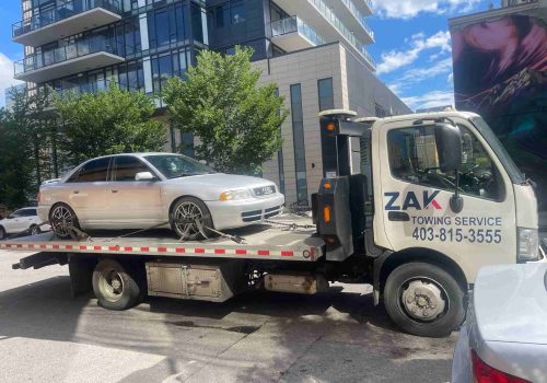 Zak Towing Service safely transports an Audi sedan on a flatbed tow truck in Calgary, Alberta. We provide 24/7 flatbed towing, emergency roadside assistance, accident recovery, and long-distance towin...Sorry but this string is too long !!!