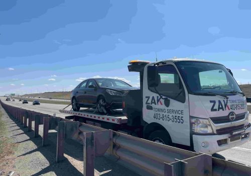Zak Towing flatbed truck providing emergency towing service in Calgary