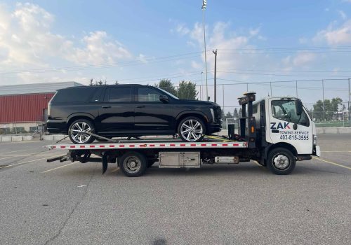 Zak Towing provides reliable flatbed towing services in Calgary for SUVs, cars, and other vehicles, using secure equipment for safe transportation.